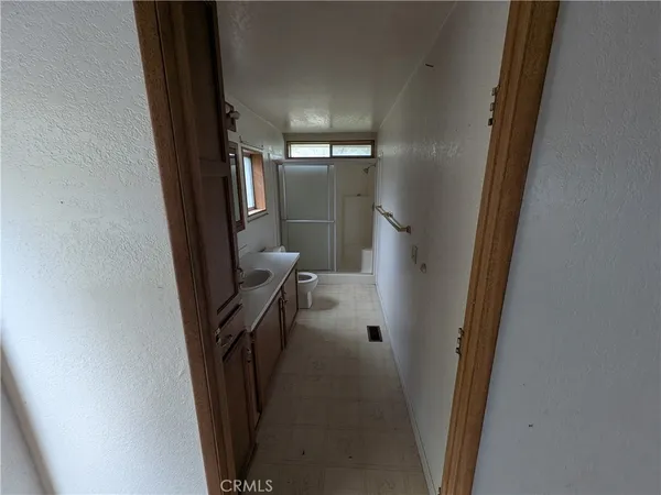 a view of a livingroom from a hallway