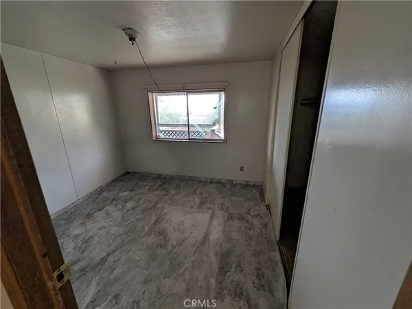 en empty room with windows