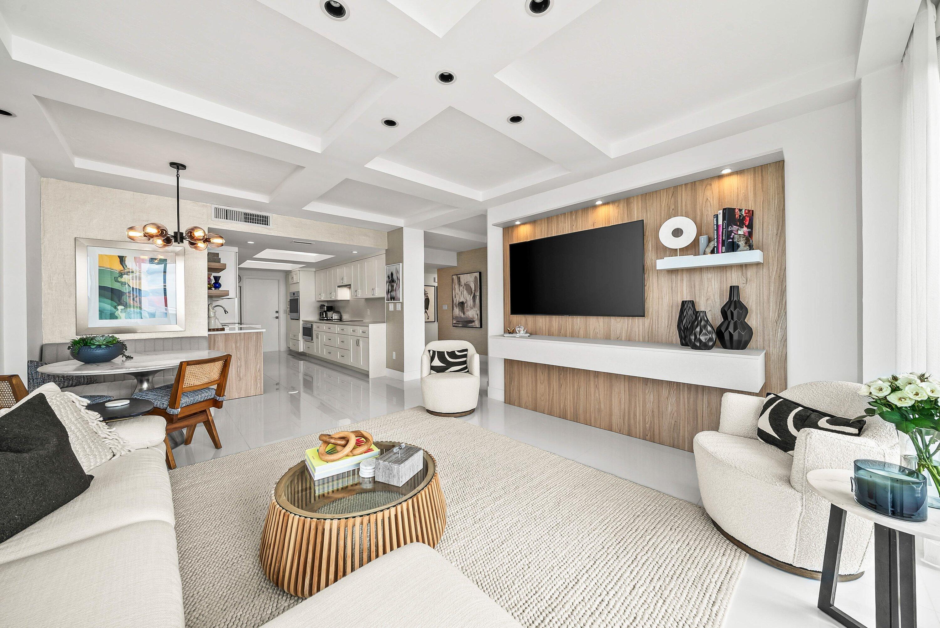 700 South Ocean Boulevard, Unit 705 Boca Raton, FL 33432 - Photo 16 of 58 a living room with furniture and a flat screen tv