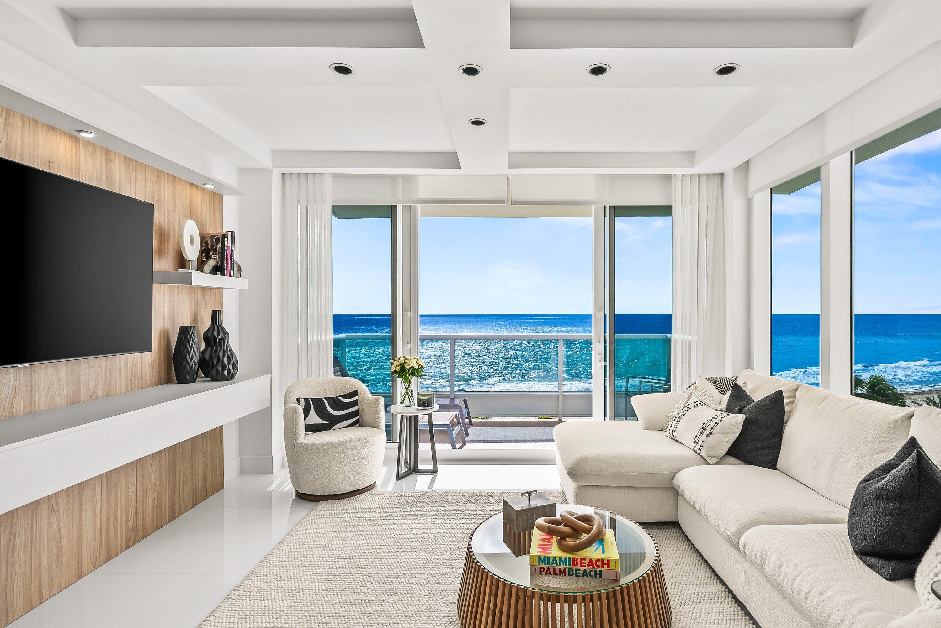 700 South Ocean Boulevard, Unit 705 Boca Raton, FL 33432 - Photo 2 of 58 a living room with furniture and a flat screen tv