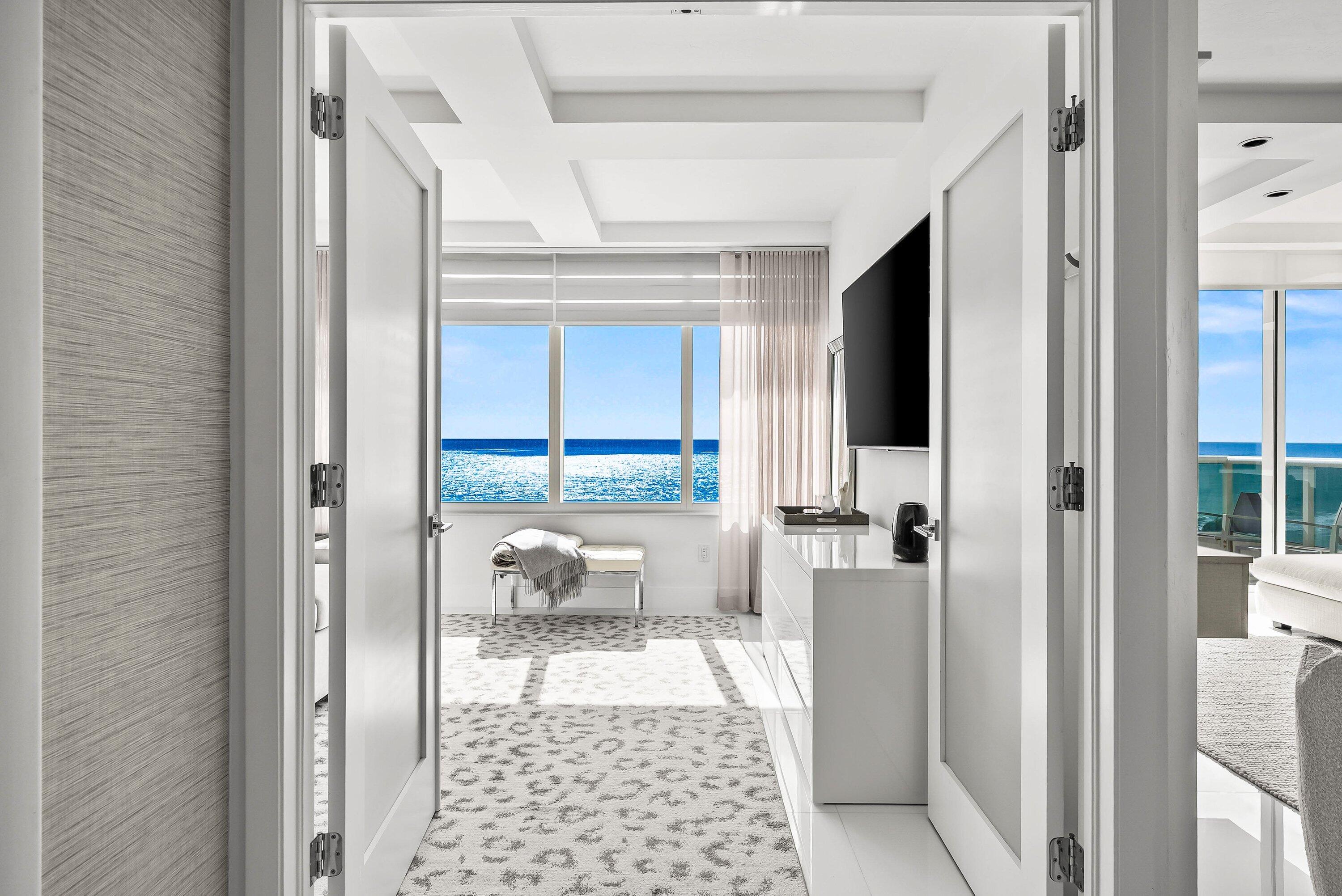 700 South Ocean Boulevard, Unit 705 Boca Raton, FL 33432 - Photo 21 of 58 a bathroom with a bathtub and a shower