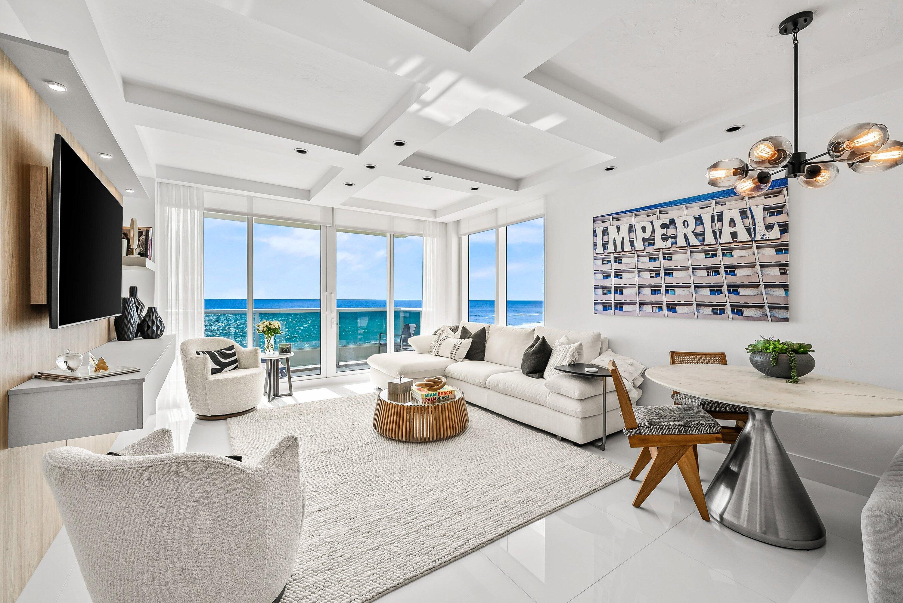 700 South Ocean Boulevard, Unit 705 Boca Raton, FL 33432 - Photo 23 of 58 a living room with furniture or outdoor view and a large window