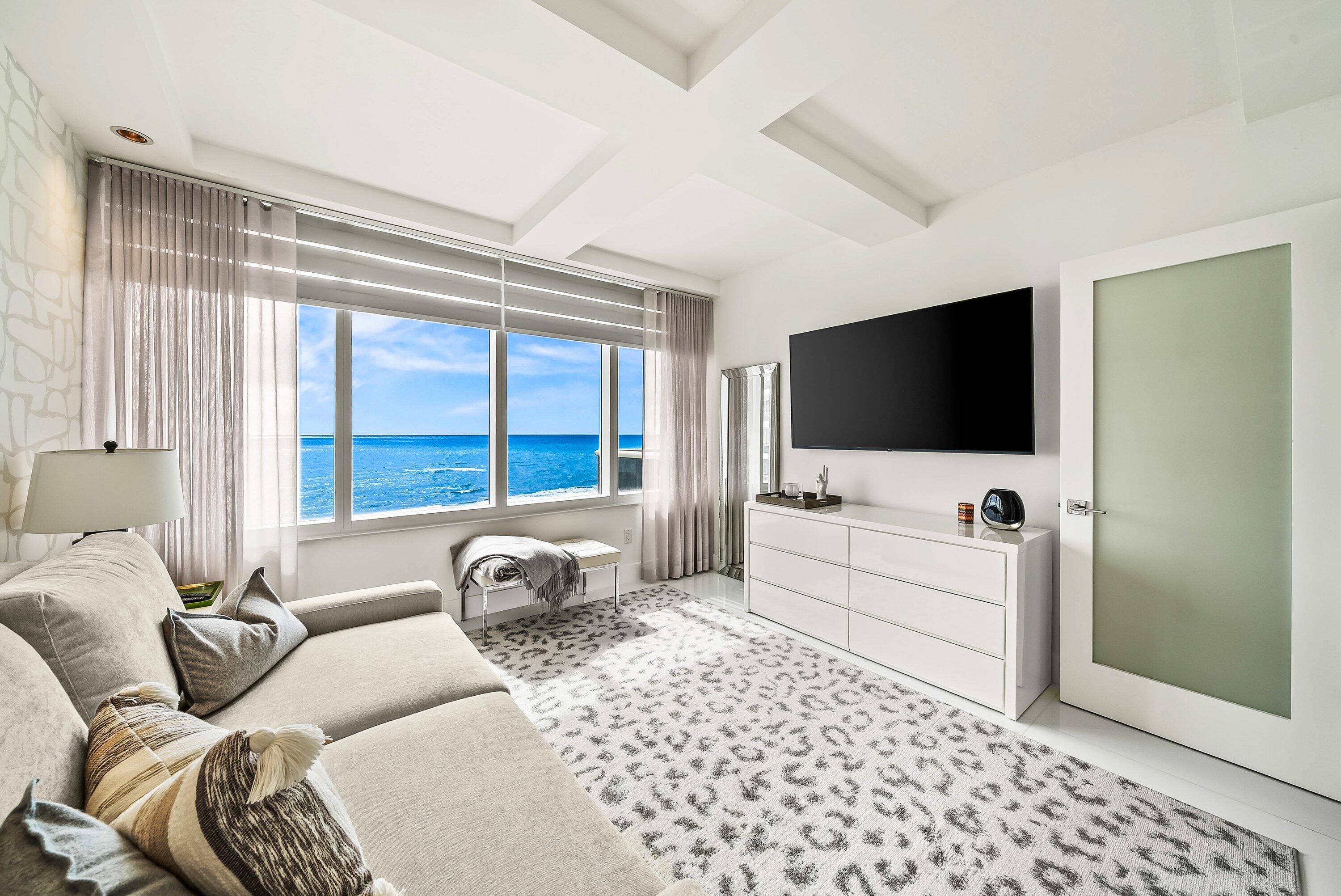 700 South Ocean Boulevard, Unit 705 Boca Raton, FL 33432 - Photo 24 of 58 a living room with furniture and a flat screen tv