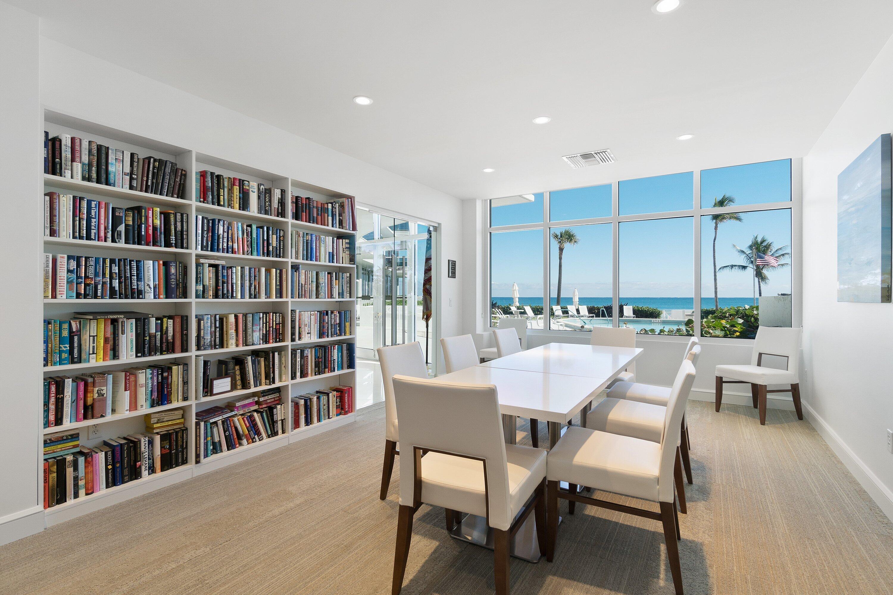 700 South Ocean Boulevard, Unit 705 Boca Raton, FL 33432 - Photo 45 of 58 a dining room with furniture and a book shelf