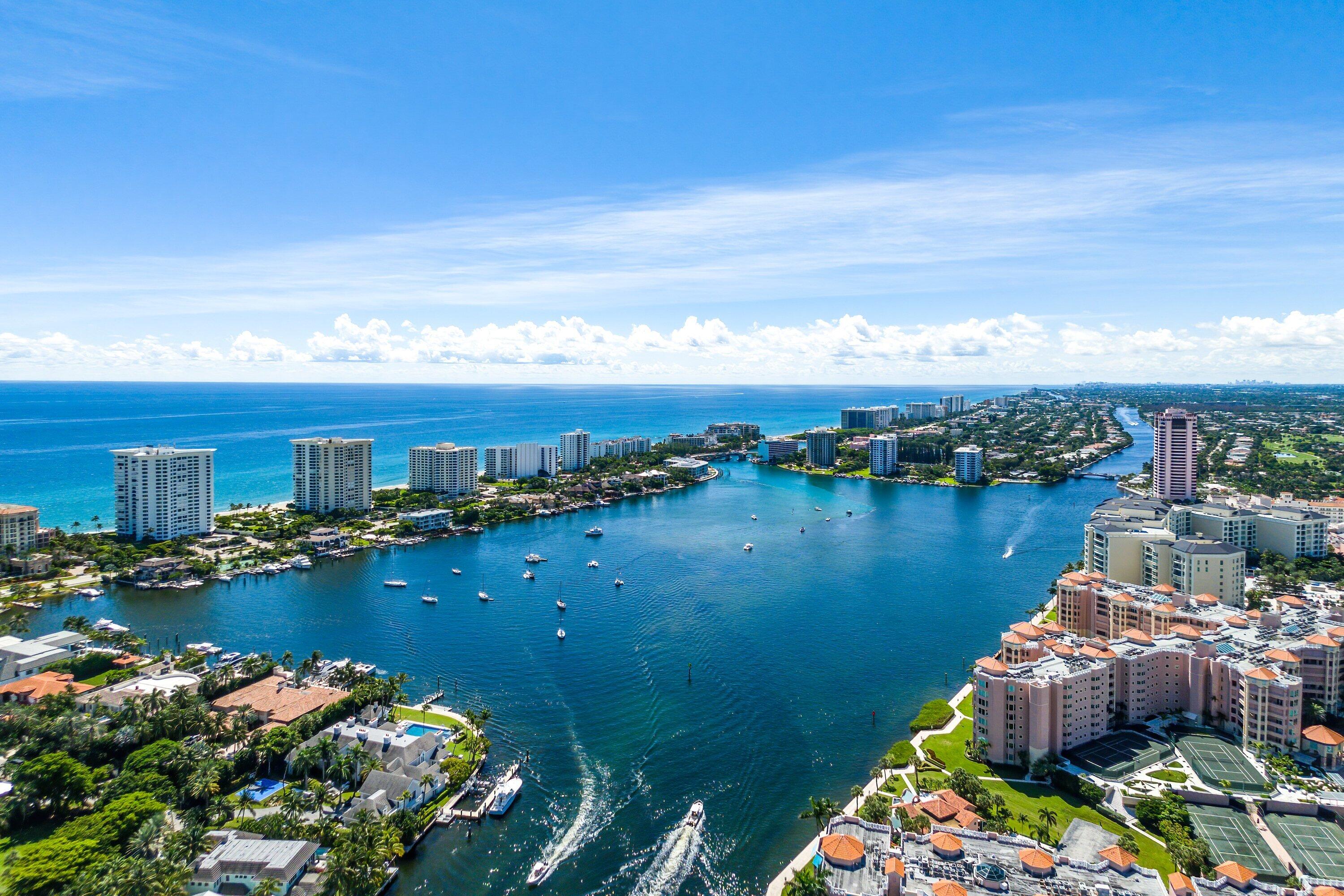 700 South Ocean Boulevard, Unit 705 Boca Raton, FL 33432 - Photo 57 of 58 a view of a lake with lawn chairs