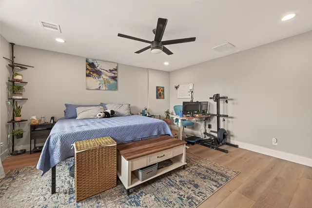 a bed room with a bed and a chandelier