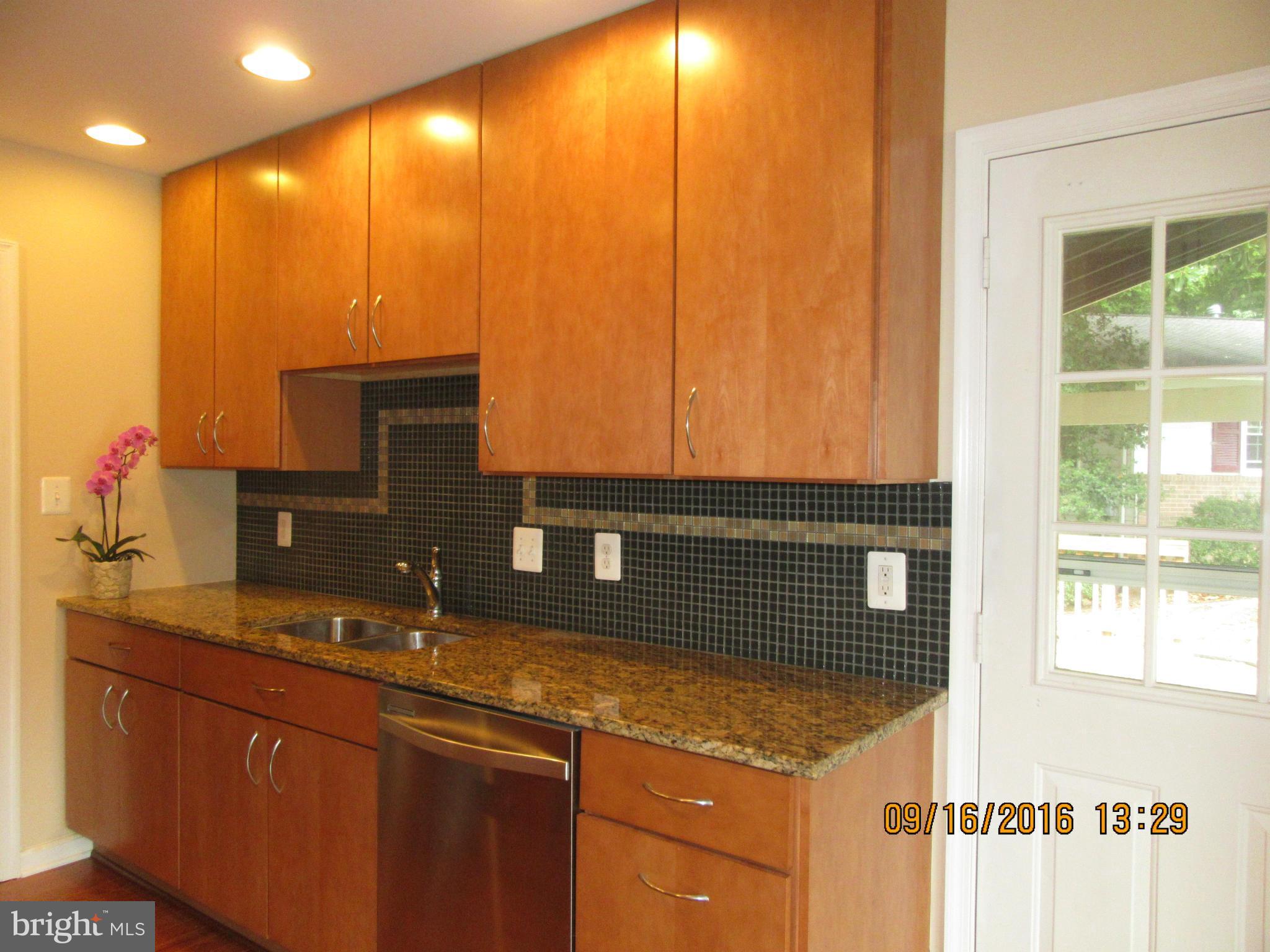 8638 Woodview Drive Springfield, VA 22153 - Photo 12 of 30 a bathroom with a sink and a mirror