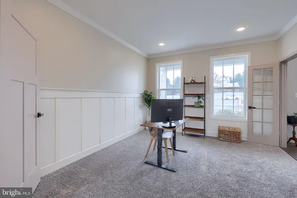 a workspace with furniture and a window