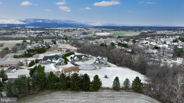 a terrace with outdoor seating and city view