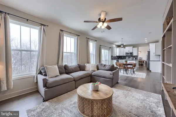 a living room with furniture and a large window