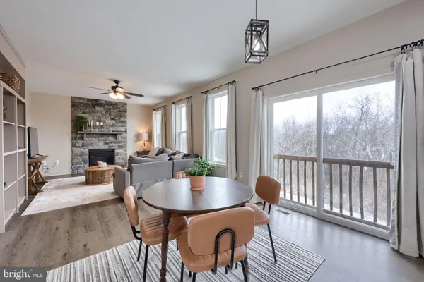 a view of a dining room with furniture window and wooden floor