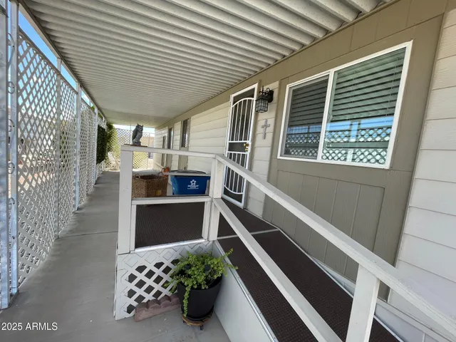 a view of an entryway with wooden floor and windows