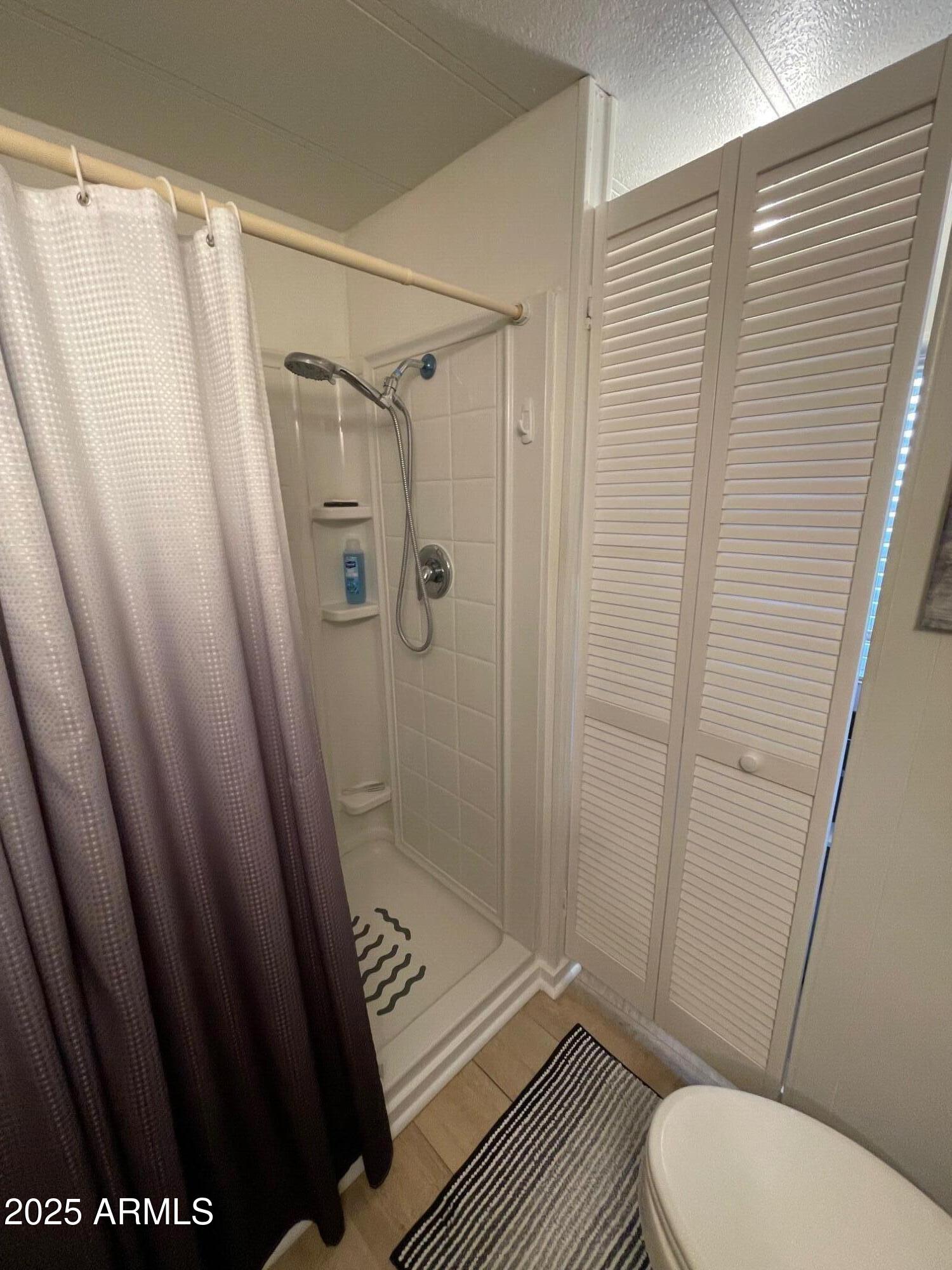 980 East Broadway Avenue, Unit 15 Apache Junction, AZ 85119 - Photo 15 of 24 a bathroom with a sink and a shower