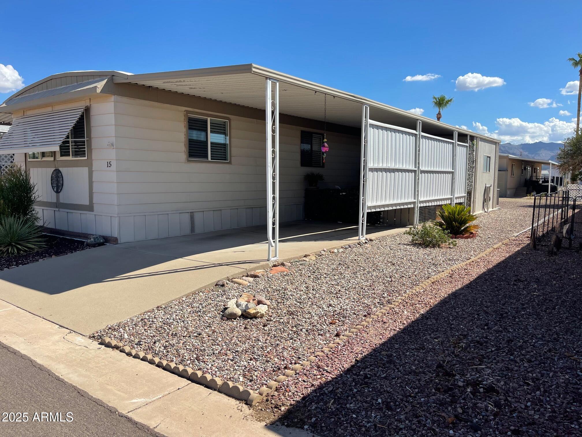 980 East Broadway Avenue, Unit 15 Apache Junction, AZ 85119 - Photo 2 of 24 a front view of a house