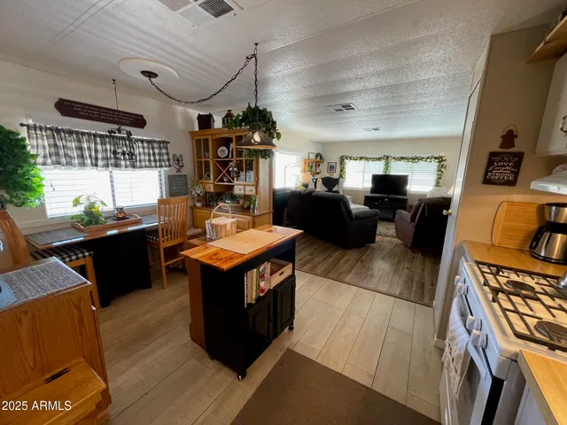 a kitchen with a stove and a refrigerator