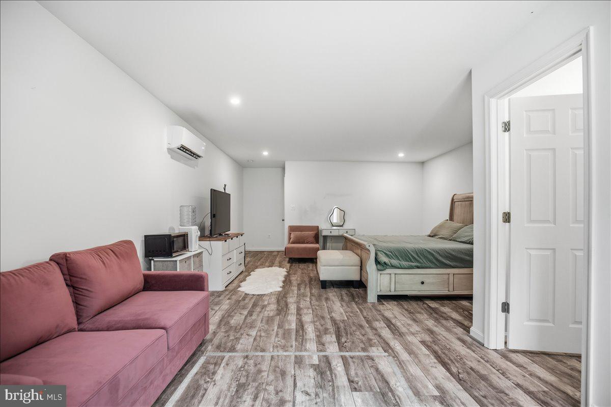 16146 Thomas Road Piney Point, MD 20674 - Photo 63 of 70 a bed room with bed and a couch