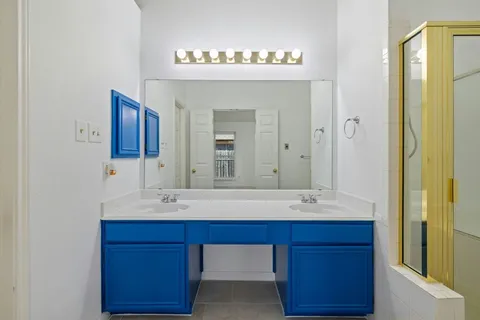 a bathroom with a sink and a mirror