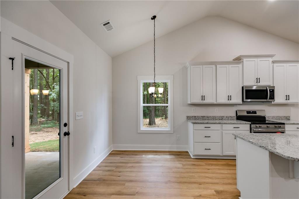 Tract3 Drummond Road Cedartown, GA 30125 - Photo 16 of 41 a kitchen with stainless steel appliances granite countertop a stove a sink and a microwave