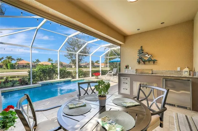 a dining room with furniture a rug and wooden floor