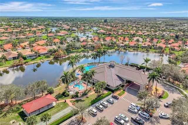 an aerial view of a house with a lake view