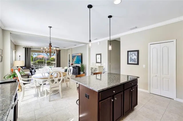 a view of a dining room furniture and floor to ceiling windows