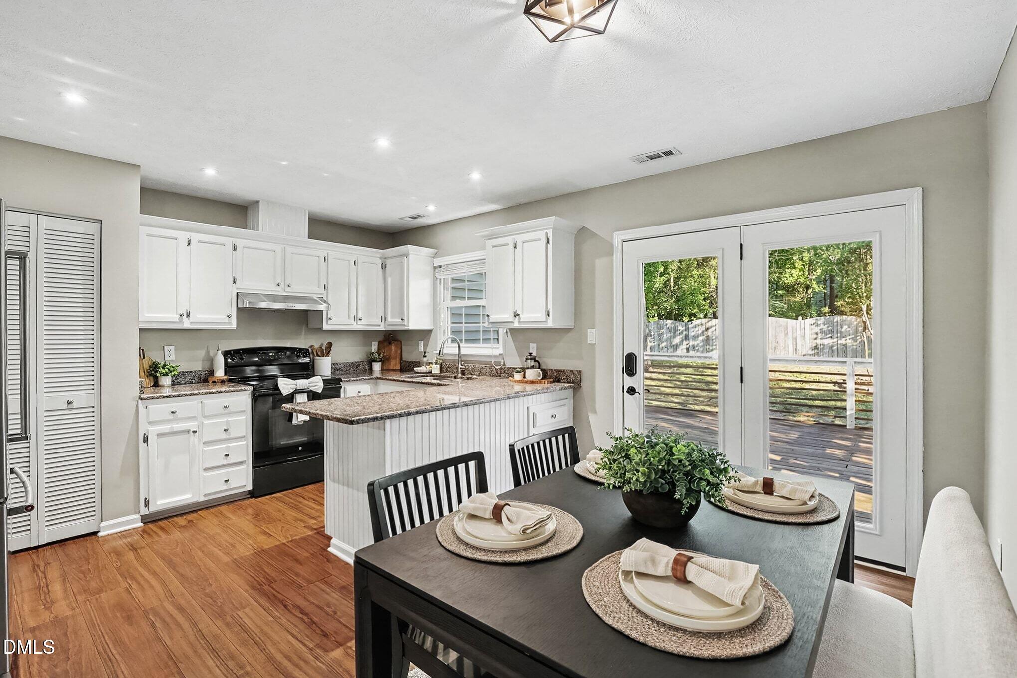 2504 Village Grove Road Raleigh, NC 27613 - Photo 8 of 26 Dining Room and Kitchen