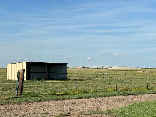 a view of a swimming pool and a big yard