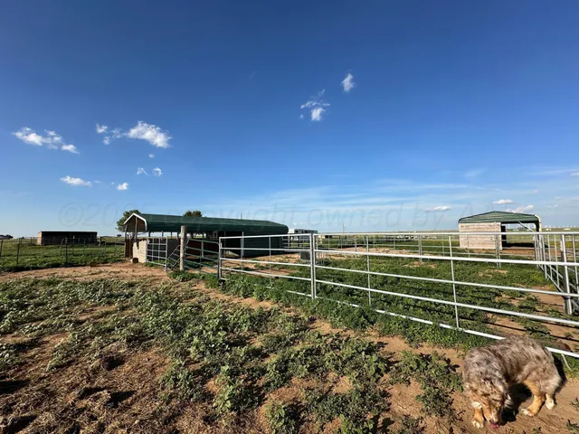 a view of a field with an outdoor space