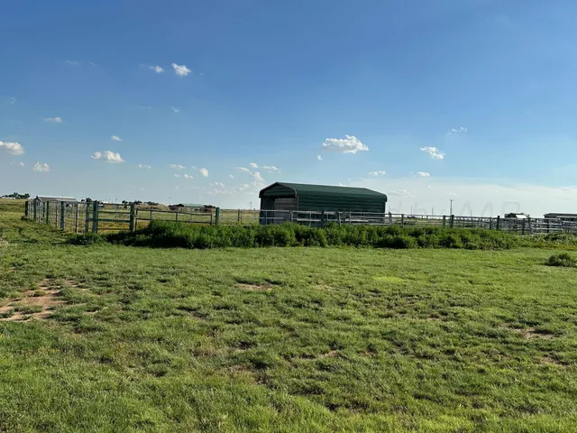 a view of a lake with a yard