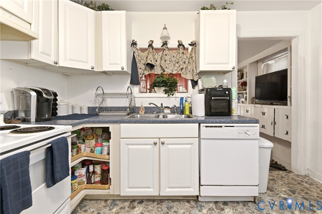 1311 Williamsburg Road Richmond, VA 23231 - Photo 17 of 38 Kitchen featuring white cabinetry and a blue count