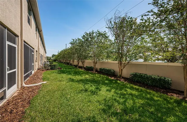 a view of house with yard