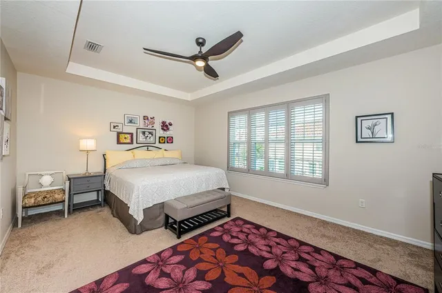 a bathroom with a granite countertop sink mirror and shower