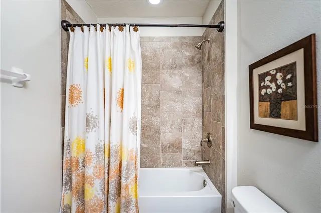 a view of a hallway with dining area