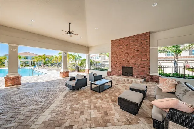 a view of swimming pool with chairs