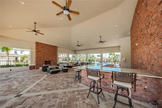 a view of a house with swimming pool and a yard