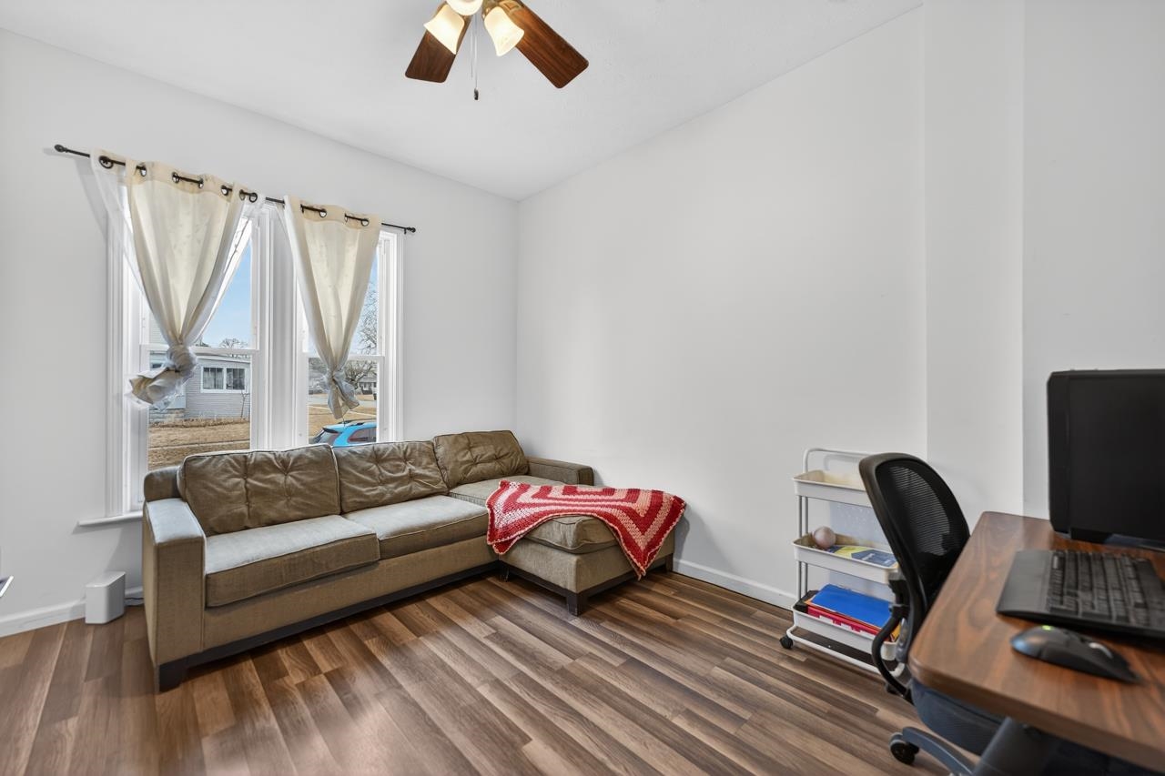 922 Lincoln Avenue Rochelle, IL 61068 - Photo 10 of 46 a bedroom with a bed and a couch