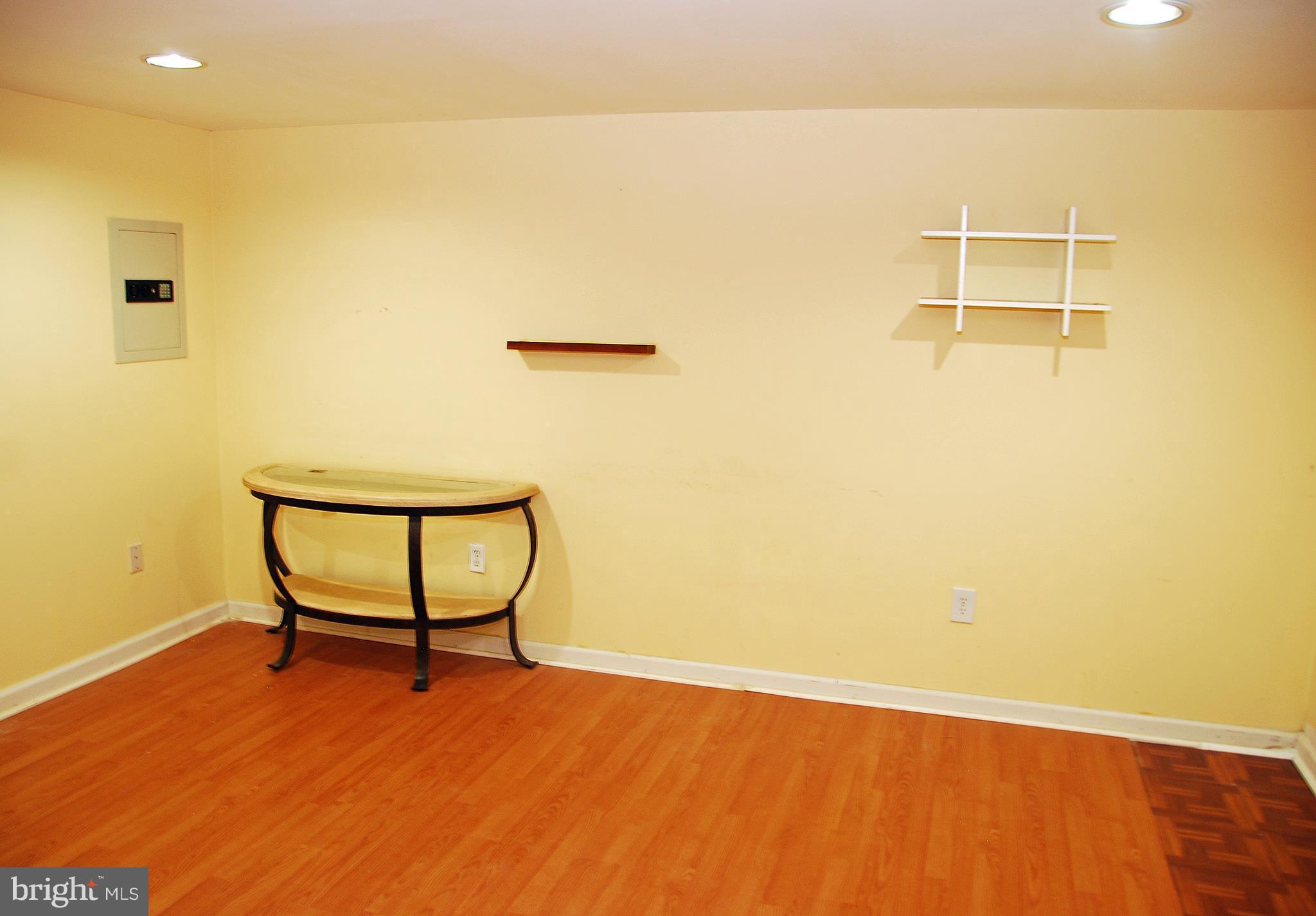 10 Congaree Court Baltimore, MD 21236 - Photo 12 of 22 a view of a room with wooden floor and a bench