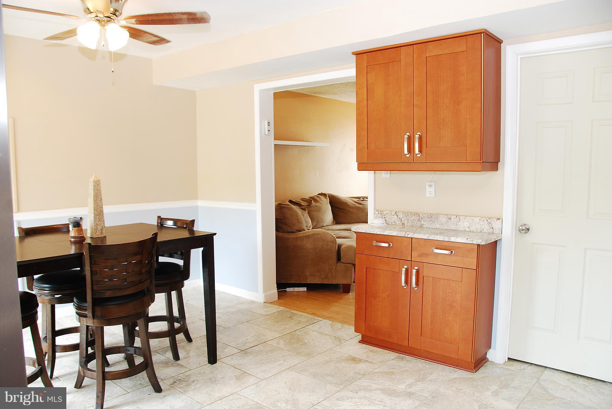 10 Congaree Court Baltimore, MD 21236 - Photo 6 of 22 a room with a table and chairs
