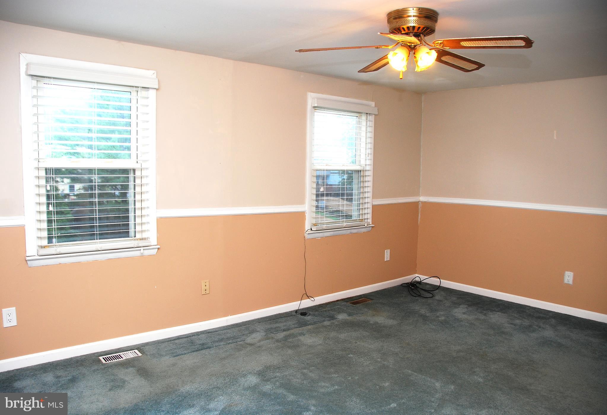 10 Congaree Court Baltimore, MD 21236 - Photo 7 of 22 an empty room with windows and fan