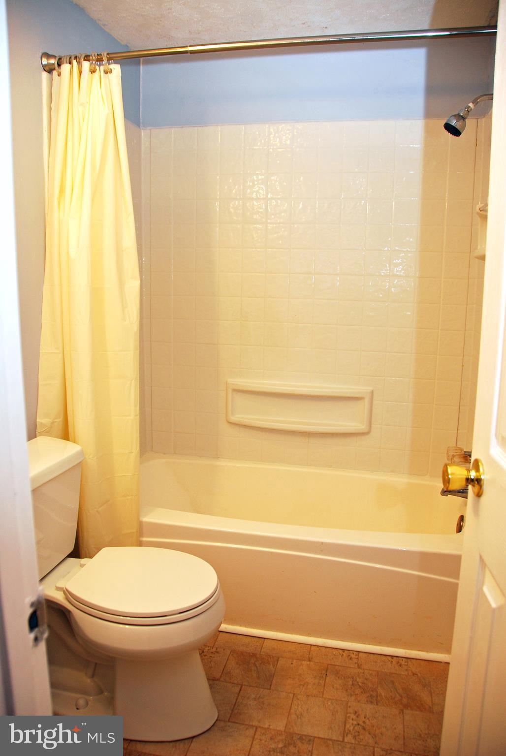 10 Congaree Court Baltimore, MD 21236 - Photo 10 of 22 a bathroom with a toilet and a shower