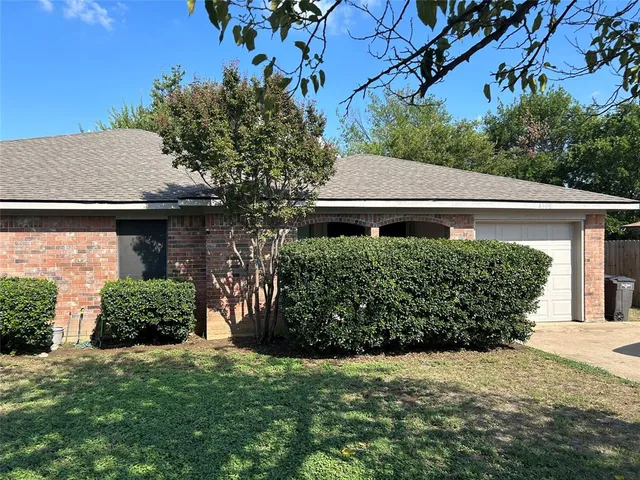 a view of a house with a garden