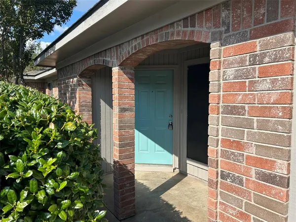 a view of an empty room with a fireplace