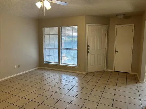 a view of room with window and hallway