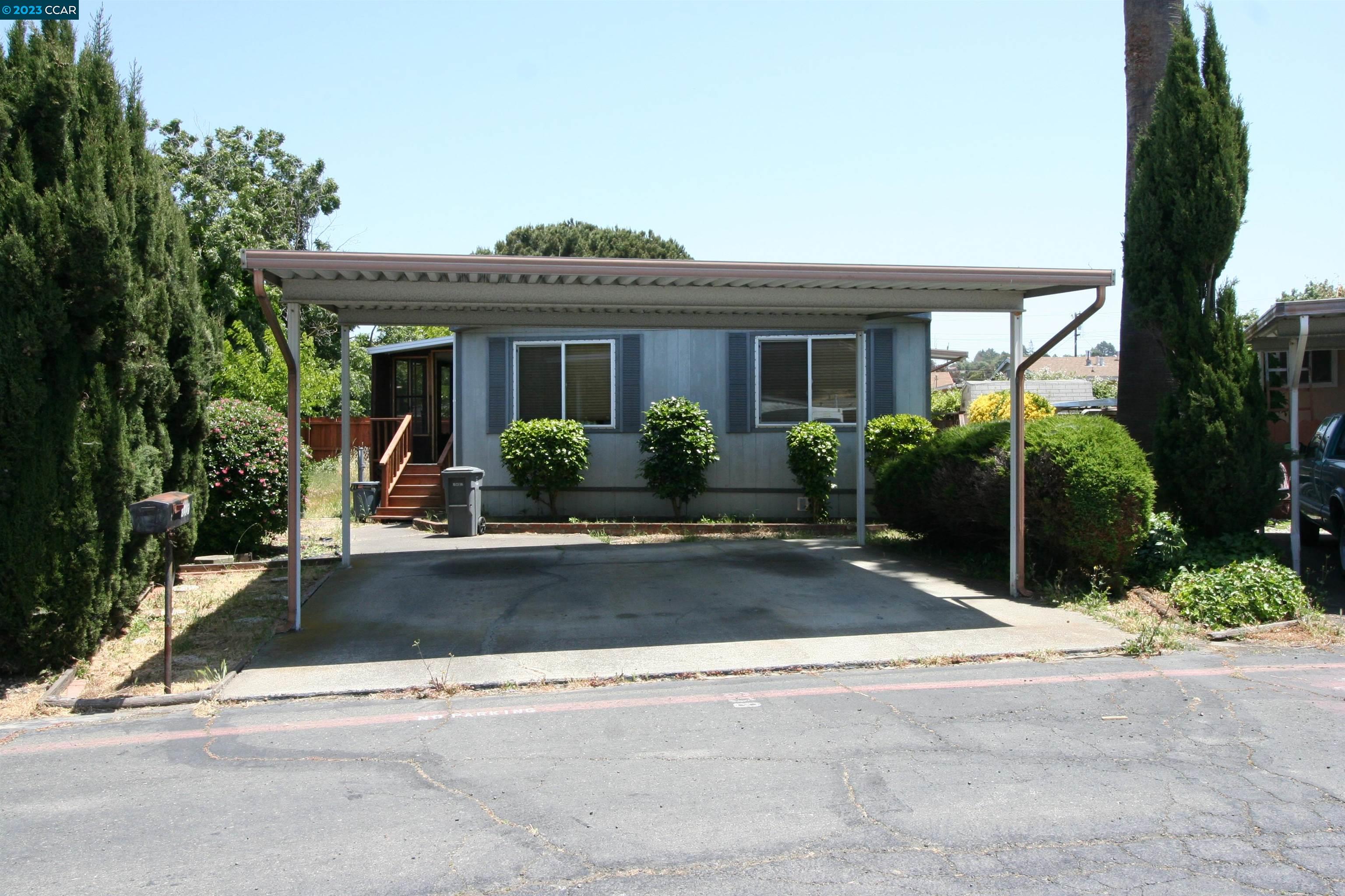 front view of a house with a yard