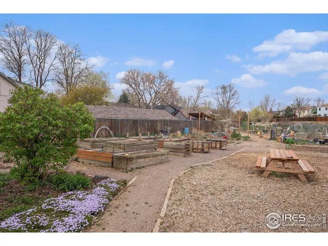 a view of a swimming pool with outdoor seating and a potted plant