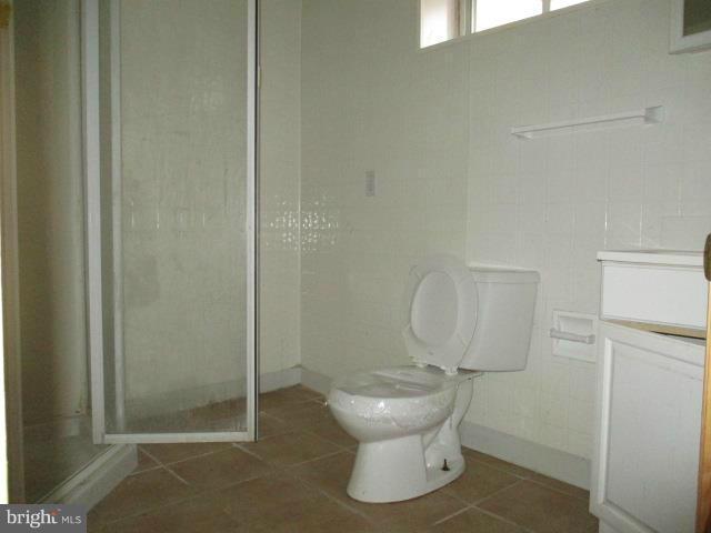 1934 Edgewood Road Baltimore, MD 21286 - Photo 22 of 23 a bathroom with a toilet and a shower