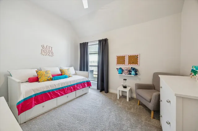 a living room with baby crib furniture and a couch