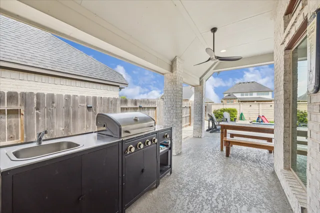 a open kitchen with stainless steel appliances granite countertop a stove and a refrigerator