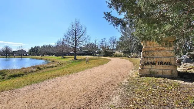 a view of road with large trees