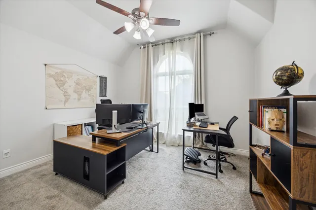 a view of a workspace with furniture